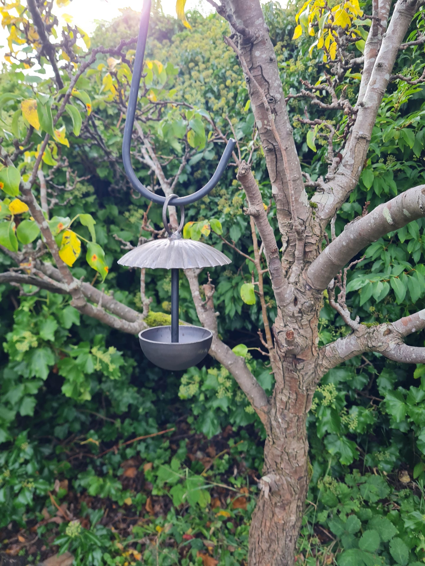 Rustic metal umbrella style hanging bird feeder