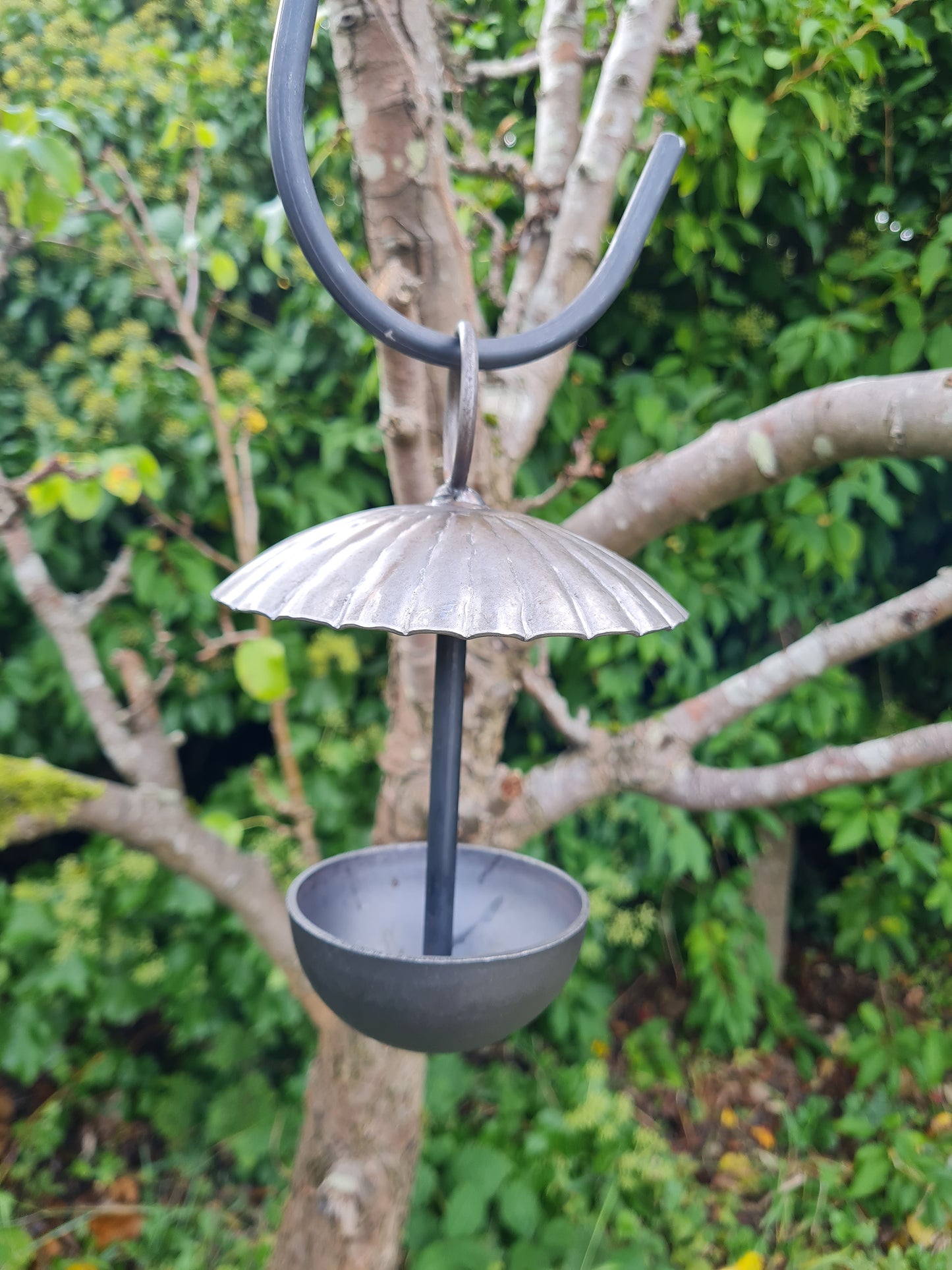 Rustic metal umbrella style hanging bird feeder